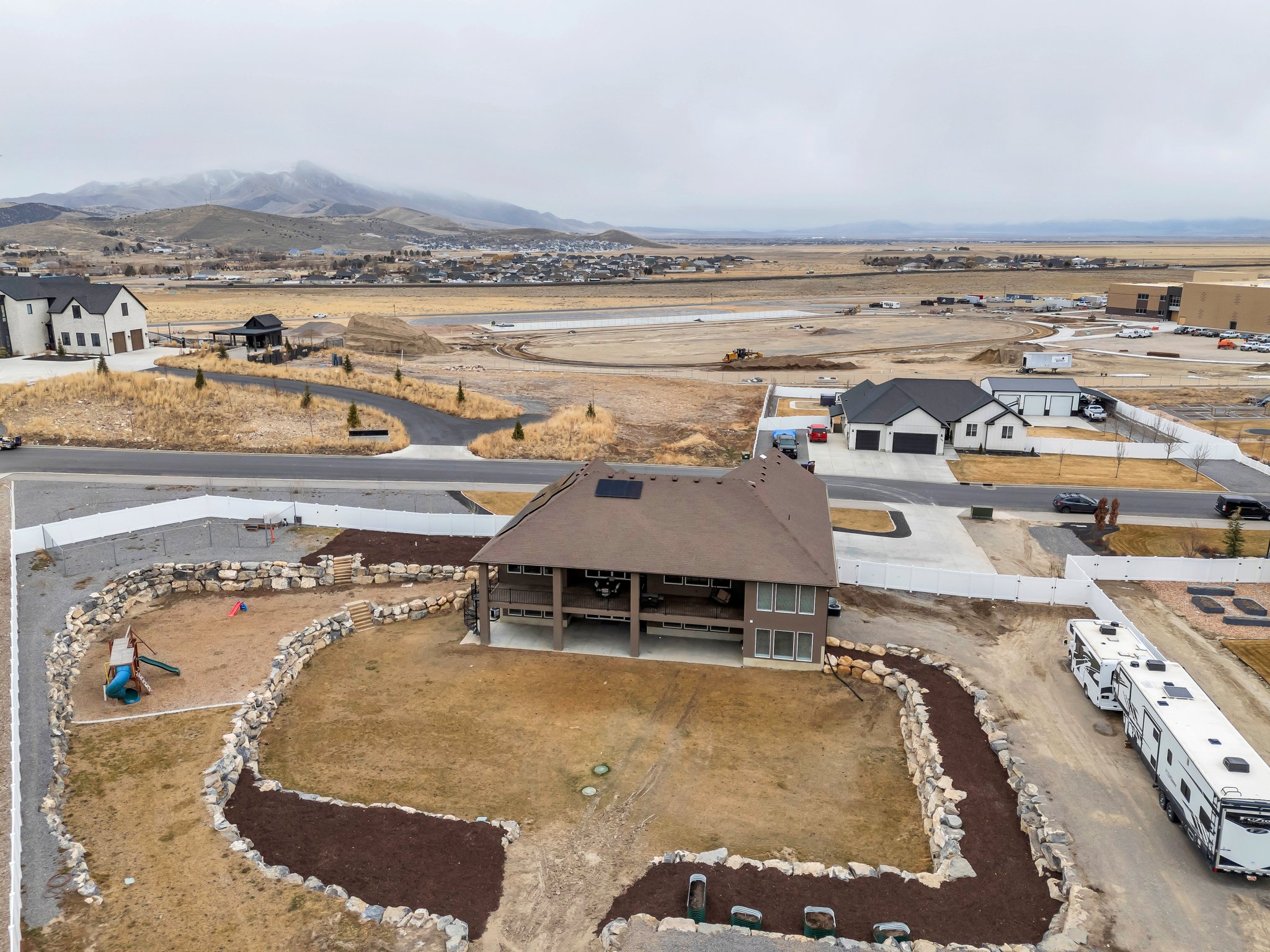 Birds eye view of property with a mountain view