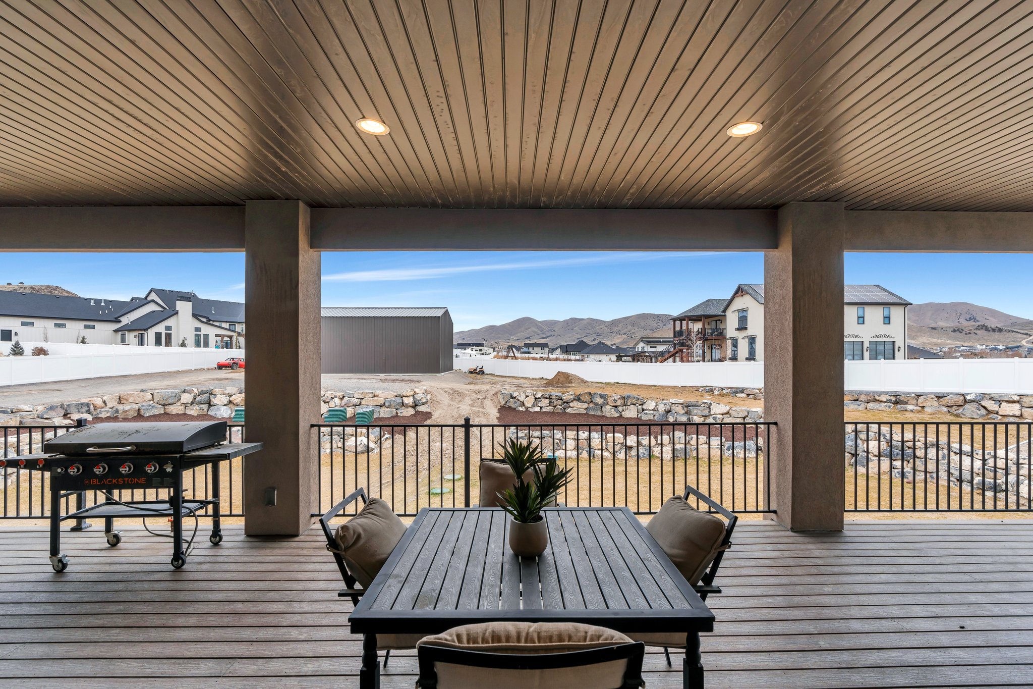 Wooden terrace featuring a mountain view and grilling area
