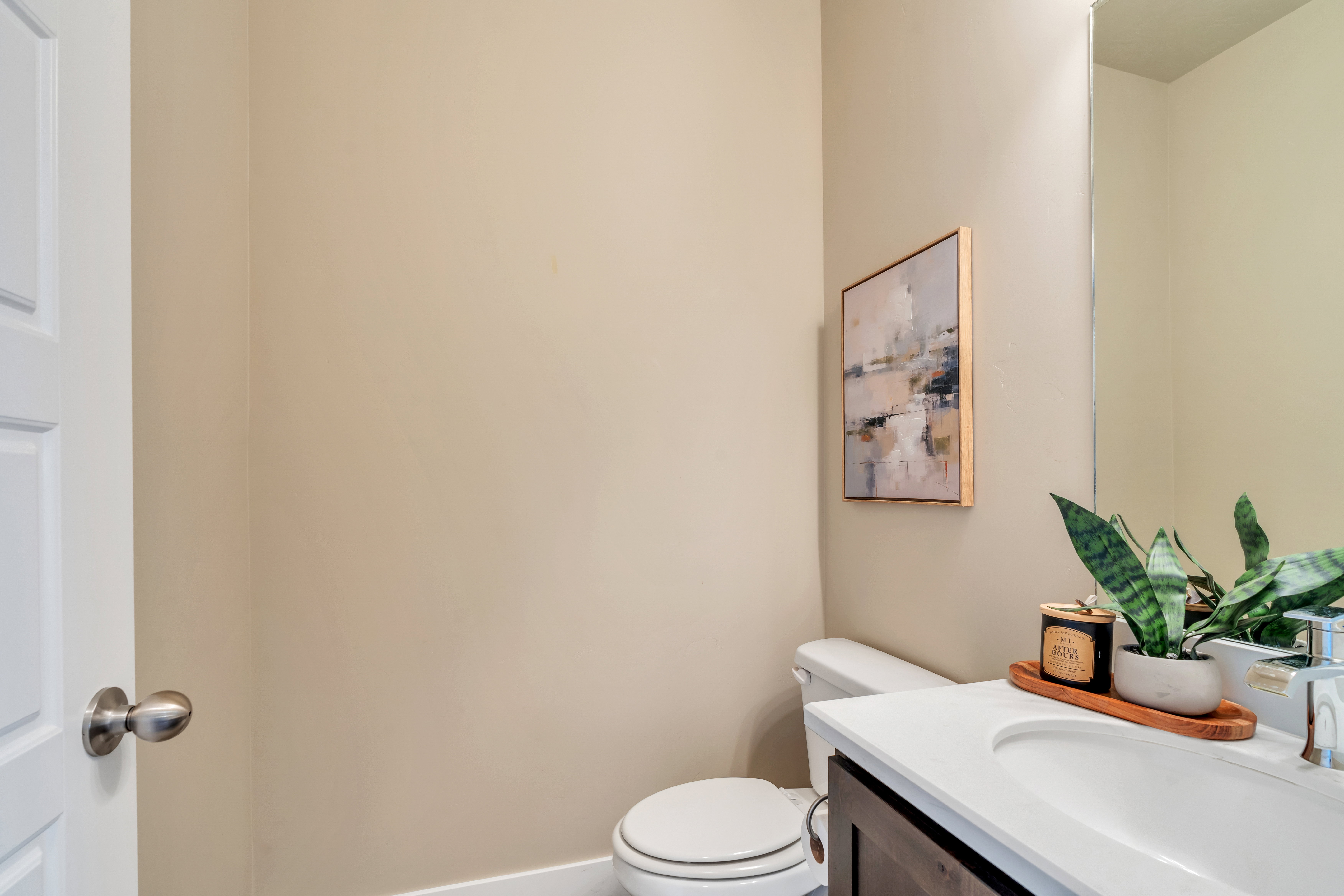 Half bathroom with vanity and toilet