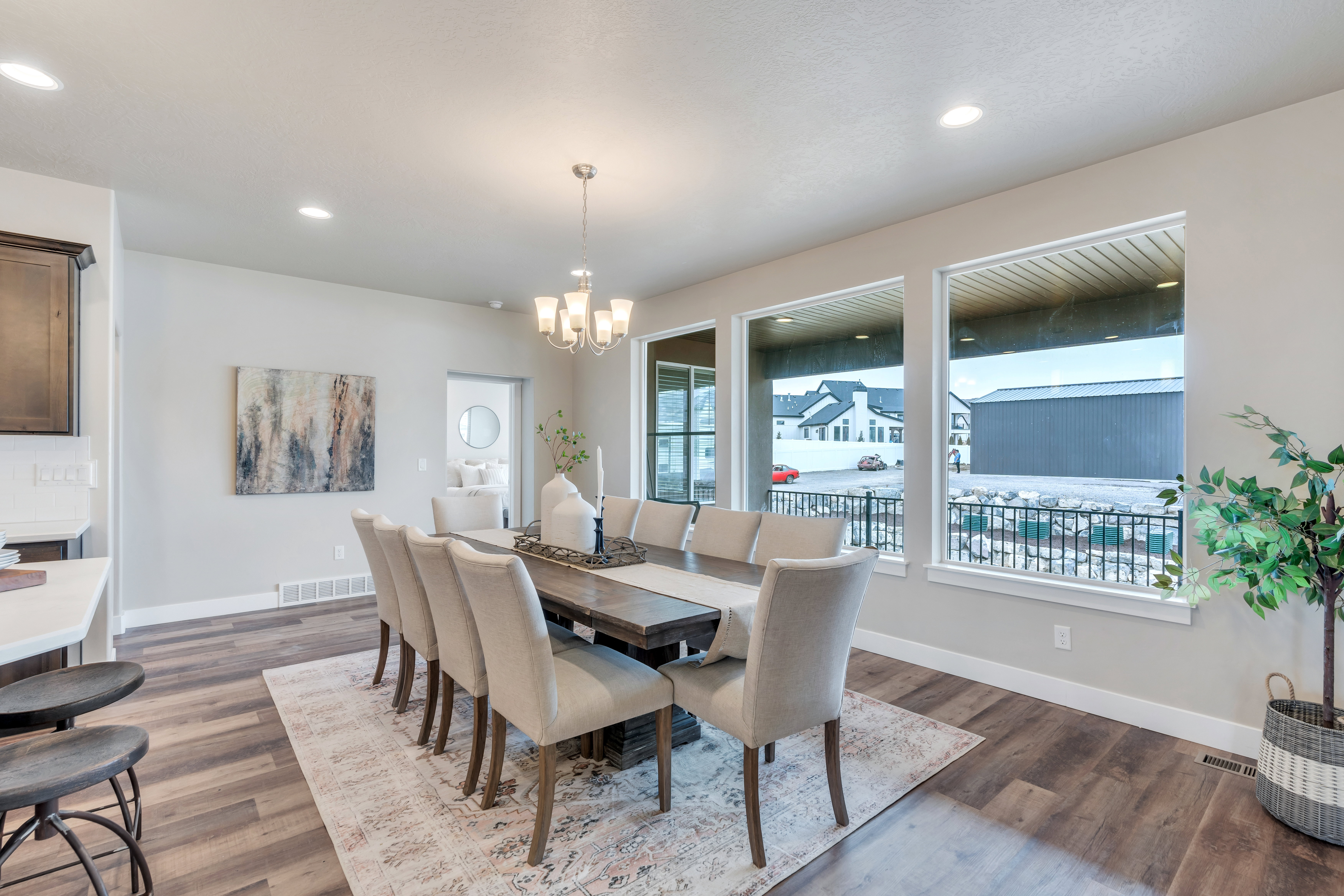 Dining area featuring a chandelier, dark wood-style flooring, and baseboards
