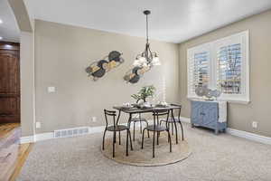 Dining space with an inviting chandelier