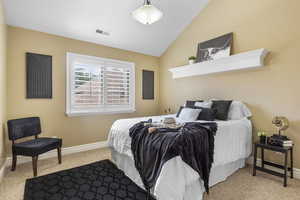 Bedroom featuring lofted ceiling