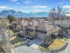 Birds eye view of property with a residential view and a mountain view