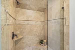 Room details featuring a tile shower