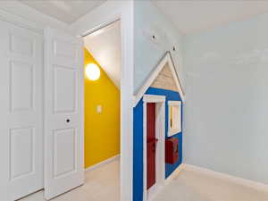 Bonus room with carpet floors, heating unit, and baseboards