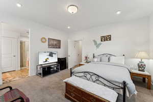 Bedroom with baseboards, carpet flooring, and recessed lighting