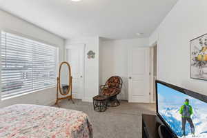 Bedroom with carpet and baseboards