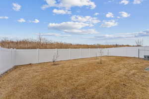 View of yard featuring a fenced backyard