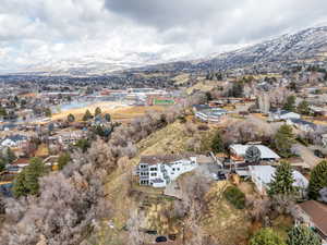 Birds eye view of property with a residential view and a mountain view