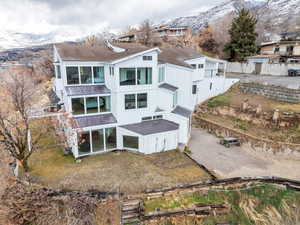 Back of property with a mountain view