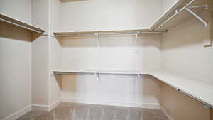 Walk in closet featuring carpet