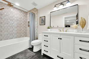 Bathroom with visible vents, vanity, tile patterned flooring, and toilet