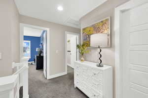 Hallway featuring carpet floors, recessed lighting, attic access, and baseboards