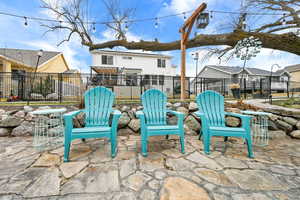 View of patio featuring fence