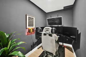 Office area featuring baseboards and wood finished floors