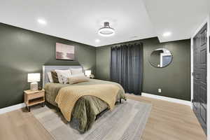 Bedroom featuring recessed lighting, light wood-style flooring, and baseboards