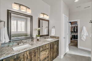 Full bathroom featuring tile patterned flooring, visible vents, and a sink