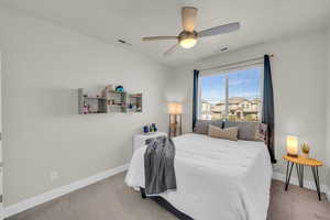 Bedroom featuring baseboards, visible vents, and carpet flooring