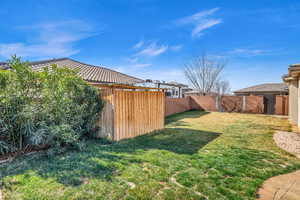 View of yard featuring a fenced backyard