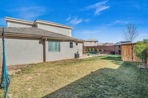 View of yard with central AC, a patio, and a fenced backyard