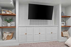 Interior details featuring carpet floors and baseboards