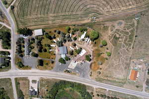 Aerial view of property and surrounding area with rural landscape