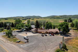 Aerial view of sparsely populated area featuring a mountainous background