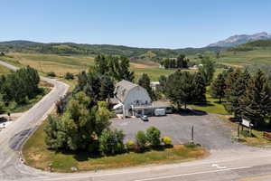 Aerial view of sparsely populated area featuring a mountainous background