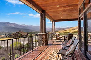 Exterior space featuring a balcony and a mountain view