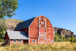 View of barn with a mountain view