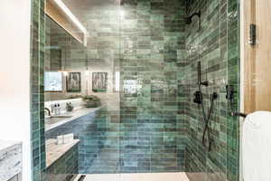 Full bath featuring a tile shower