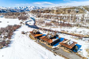 Snowy aerial view with a mountain view