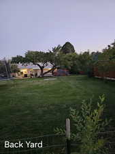 View of yard with playground community and a trampoline