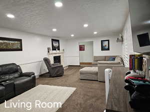 Carpeted living room featuring recessed lighting, baseboards, a textured ceiling, and a high end fireplace