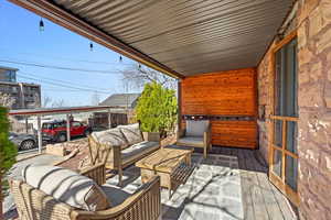 Wooden terrace featuring outdoor lounge area