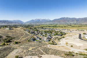 Birds eye view of property with a mountain view