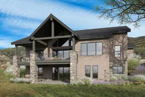 Back of house featuring a patio, a yard, stone siding, and a balcony