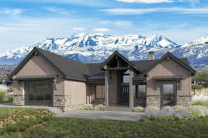 Exterior space with stone siding, a mountain view, a chimney, and a standing seam roof