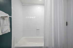 Full bathroom featuring shower / bath combo with shower curtain