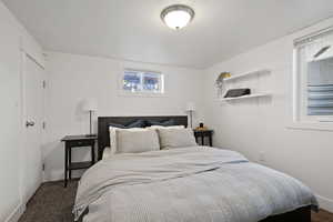 Bedroom with carpet flooring and baseboards