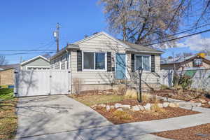 Bungalow-style home featuring fence and a gate