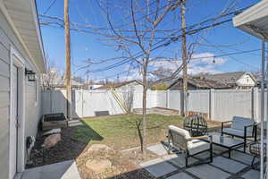 View of yard with a patio area and a fenced backyard