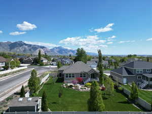 Property view of mountains with a residential view