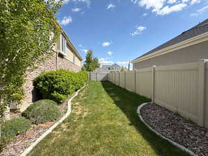 View of yard with a fenced backyard