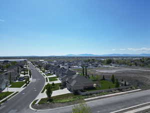 Birds eye view of property with a residential view and a mountain view