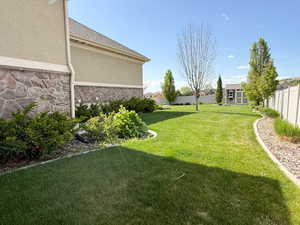 View of yard featuring an outbuilding, a fenced backyard, and a shed