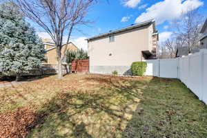 View of yard featuring a fenced backyard