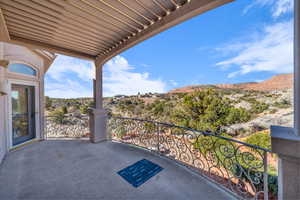 View of patio / terrace featuring a balcony and a mountain view