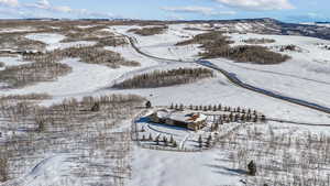 Snowy aerial view featuring a mountain view