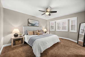 Bedroom featuring carpet flooring, visible vents, and baseboards